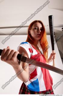 Tina STANDINGPOSE WITH DAGGER AND BASEBALL BAT 